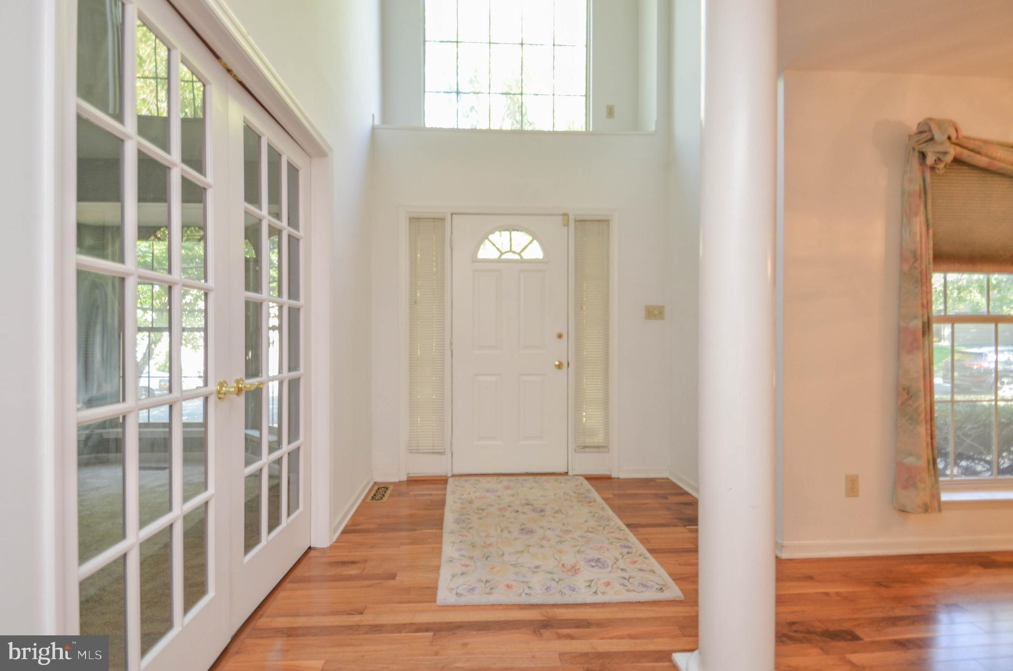 5382 Princeton Road Macungie, PA 18062 - Photo 26 of 33 a view of a hallway with wooden floor and staircase