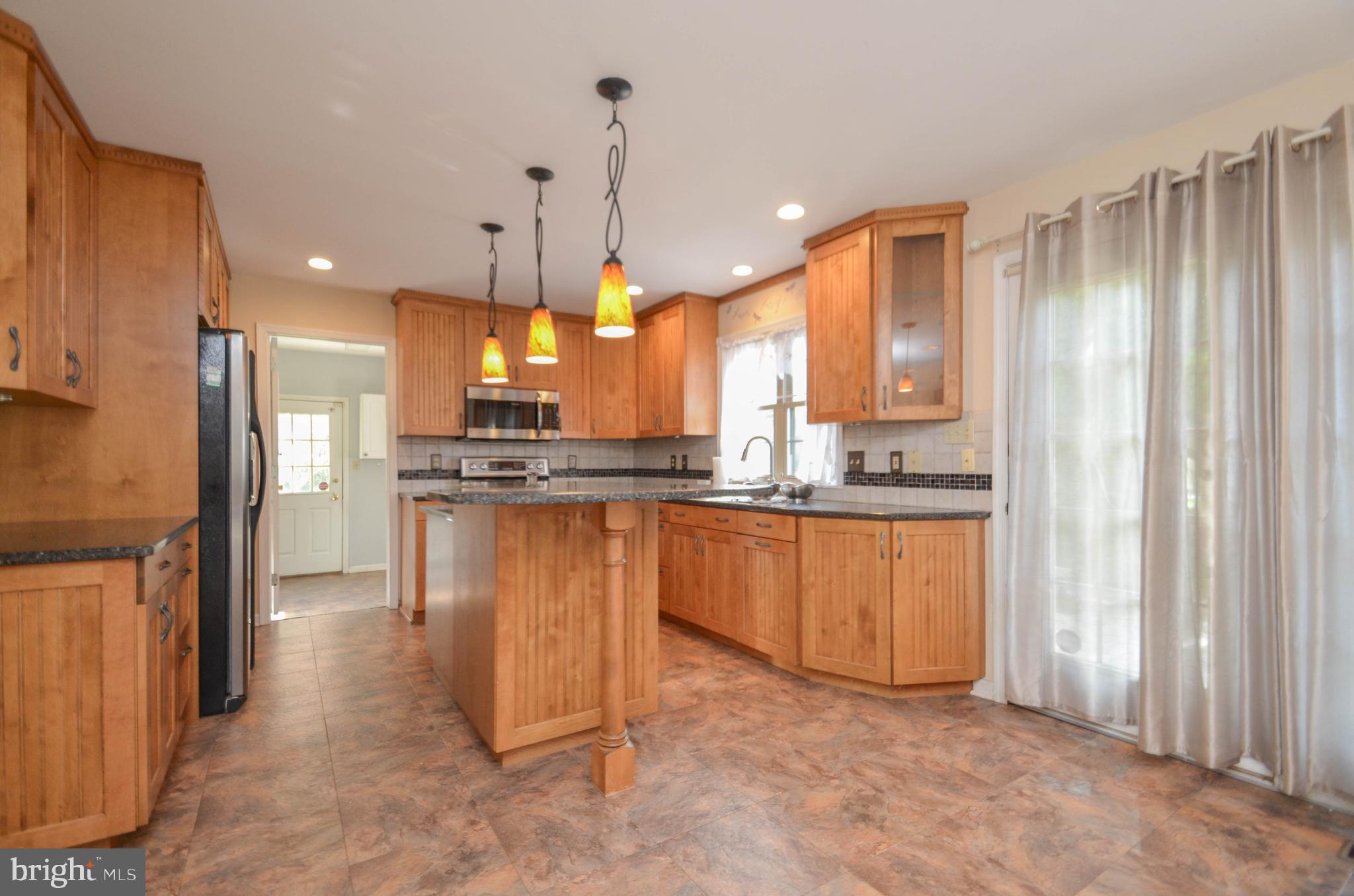 5382 Princeton Road Macungie, PA 18062 - Photo 5 of 33 a kitchen with stainless steel appliances granite countertop a refrigerator a oven a sink and a oven