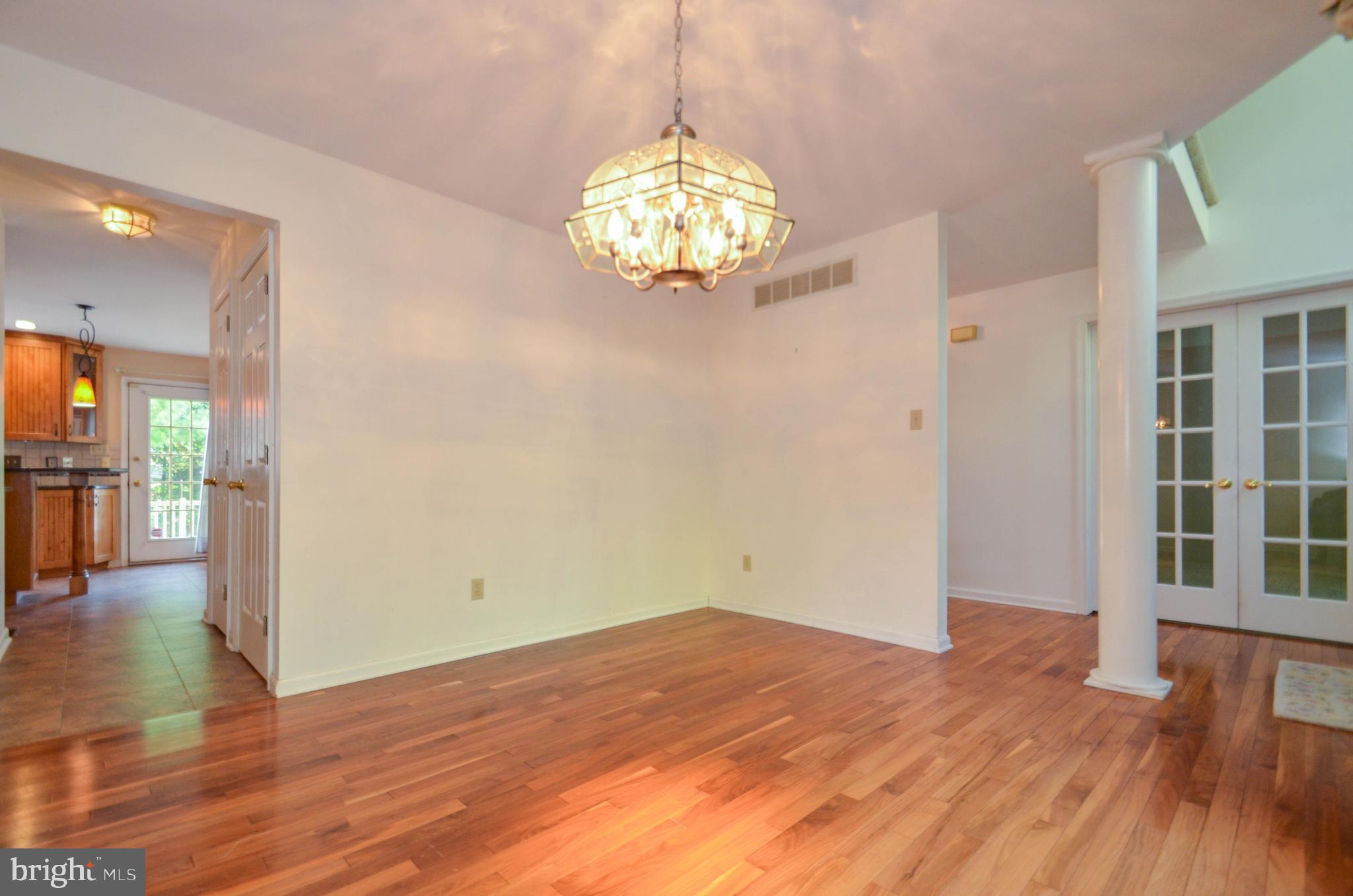 5382 Princeton Road Macungie, PA 18062 - Photo 8 of 33 a view of an empty room with wooden floor and a window