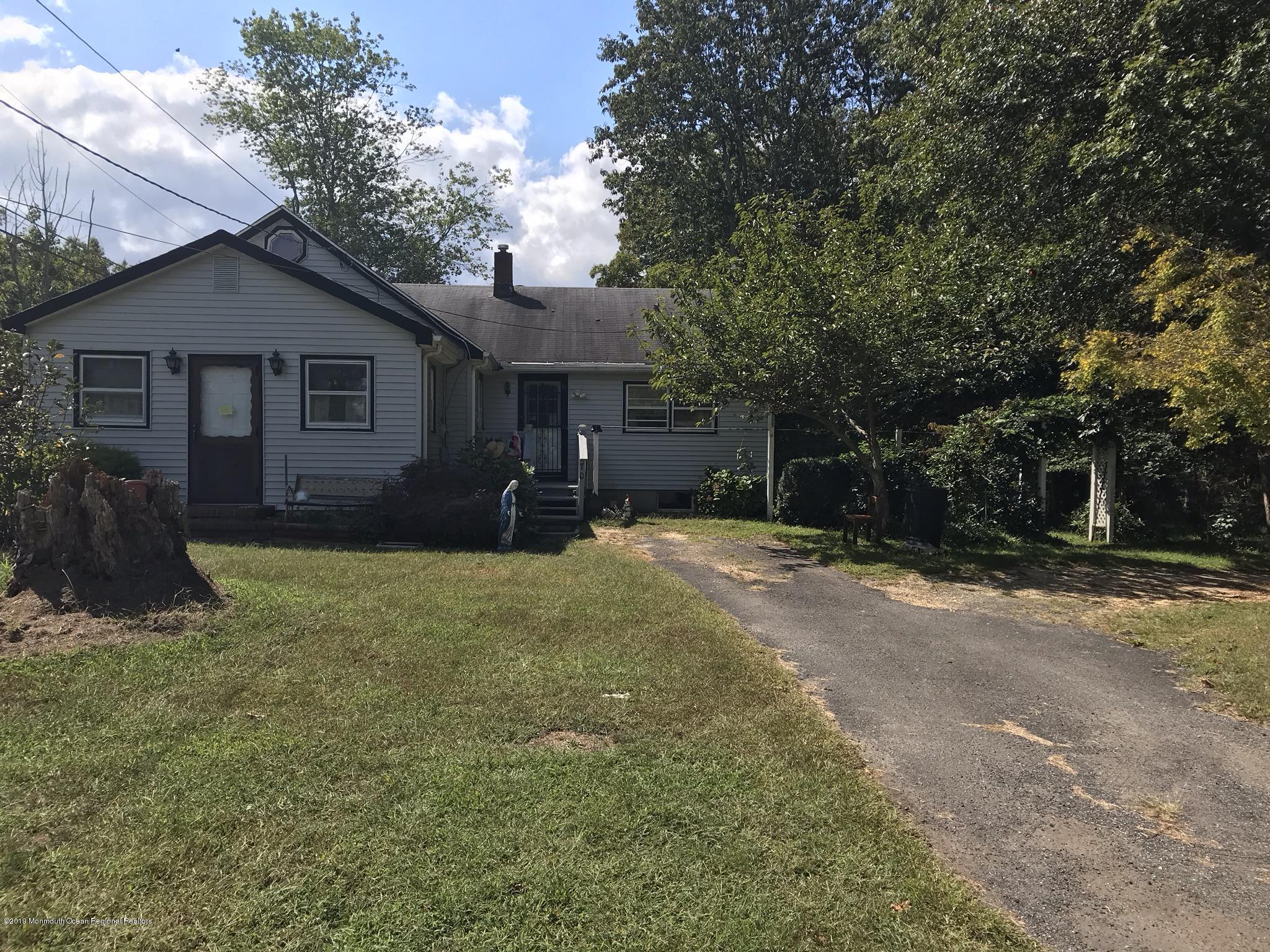 70 Pinewood Road Howell, NJ 07731 - Photo 1 of 22 a view of a house with a yard