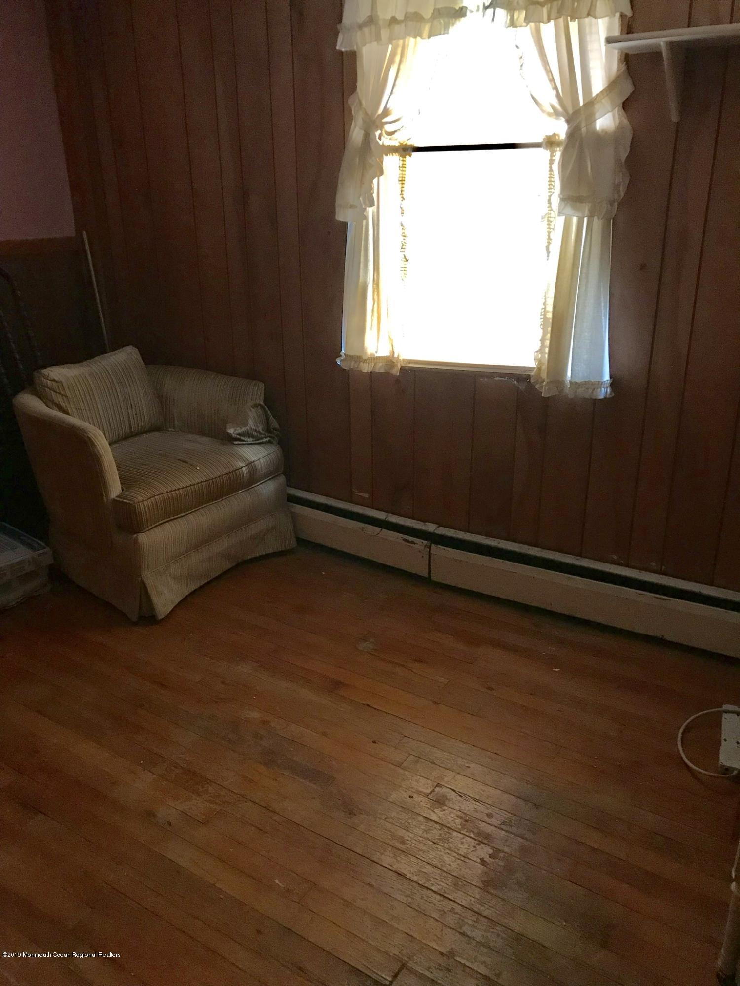 70 Pinewood Road Howell, NJ 07731 - Photo 11 of 22 a living room with furniture window and a wooden floor