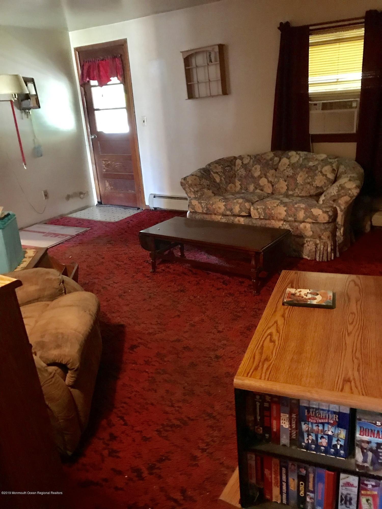 70 Pinewood Road Howell, NJ 07731 - Photo 5 of 22 a bedroom with a bed and a mirror
