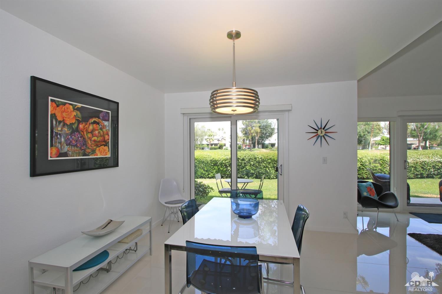 6012 East Driver Road Palm Springs, CA 92264 - Photo 19 of 47 a view of a dining room with furniture window and outside view