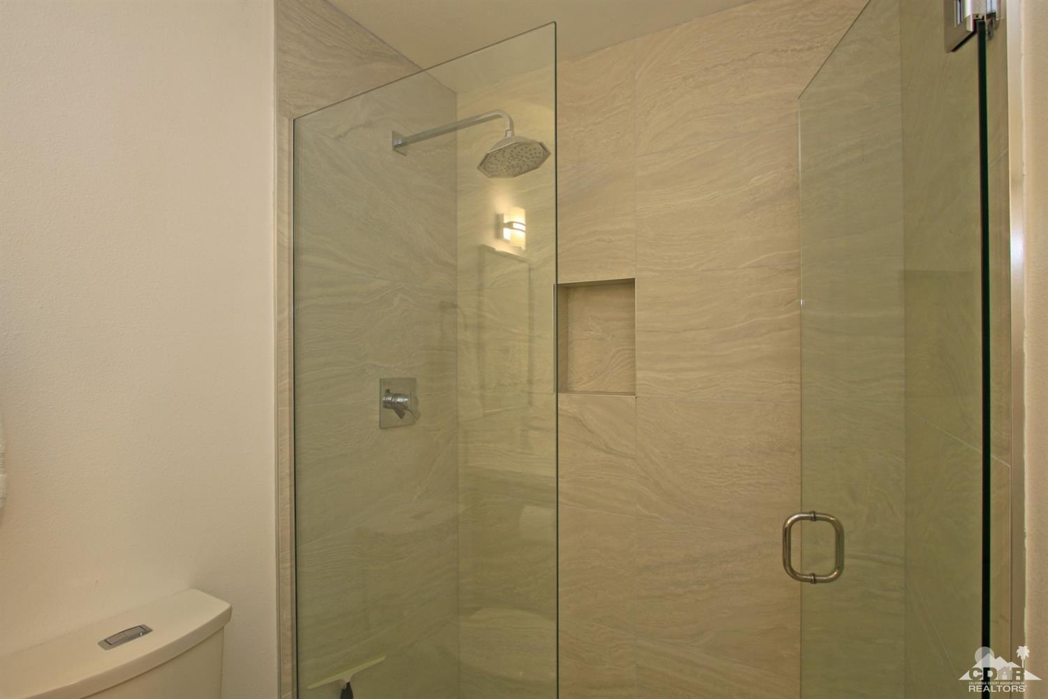 6012 East Driver Road Palm Springs, CA 92264 - Photo 26 of 47 a bathroom with a shower and a toilet
