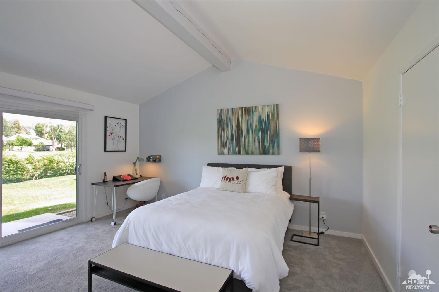 6012 East Driver Road Palm Springs, CA 92264 - Photo 29 of 47 a bedroom with a bed and a window