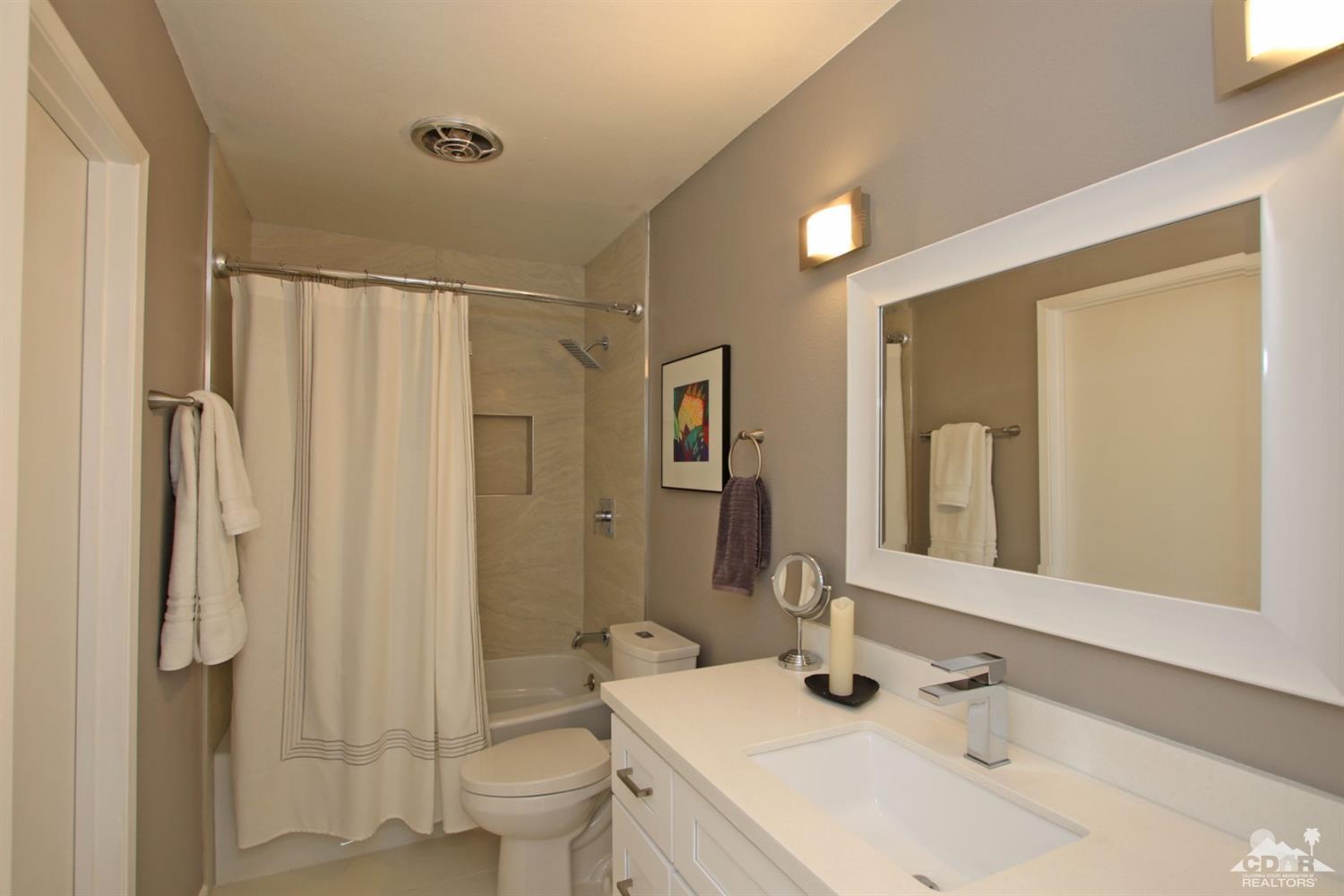 6012 East Driver Road Palm Springs, CA 92264 - Photo 32 of 47 a bathroom with a sink toilet and shower