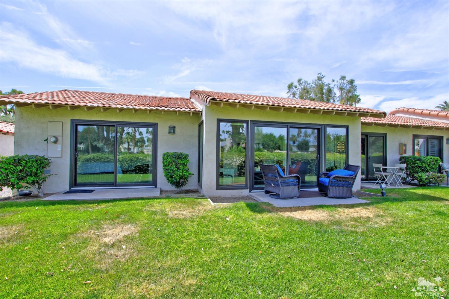 6012 East Driver Road Palm Springs, CA 92264 - Photo 33 of 47 a view of a house with garden and porch