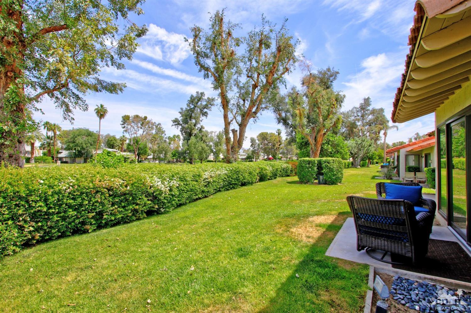 6012 East Driver Road Palm Springs, CA 92264 - Photo 34 of 47 a view of a garden with benches