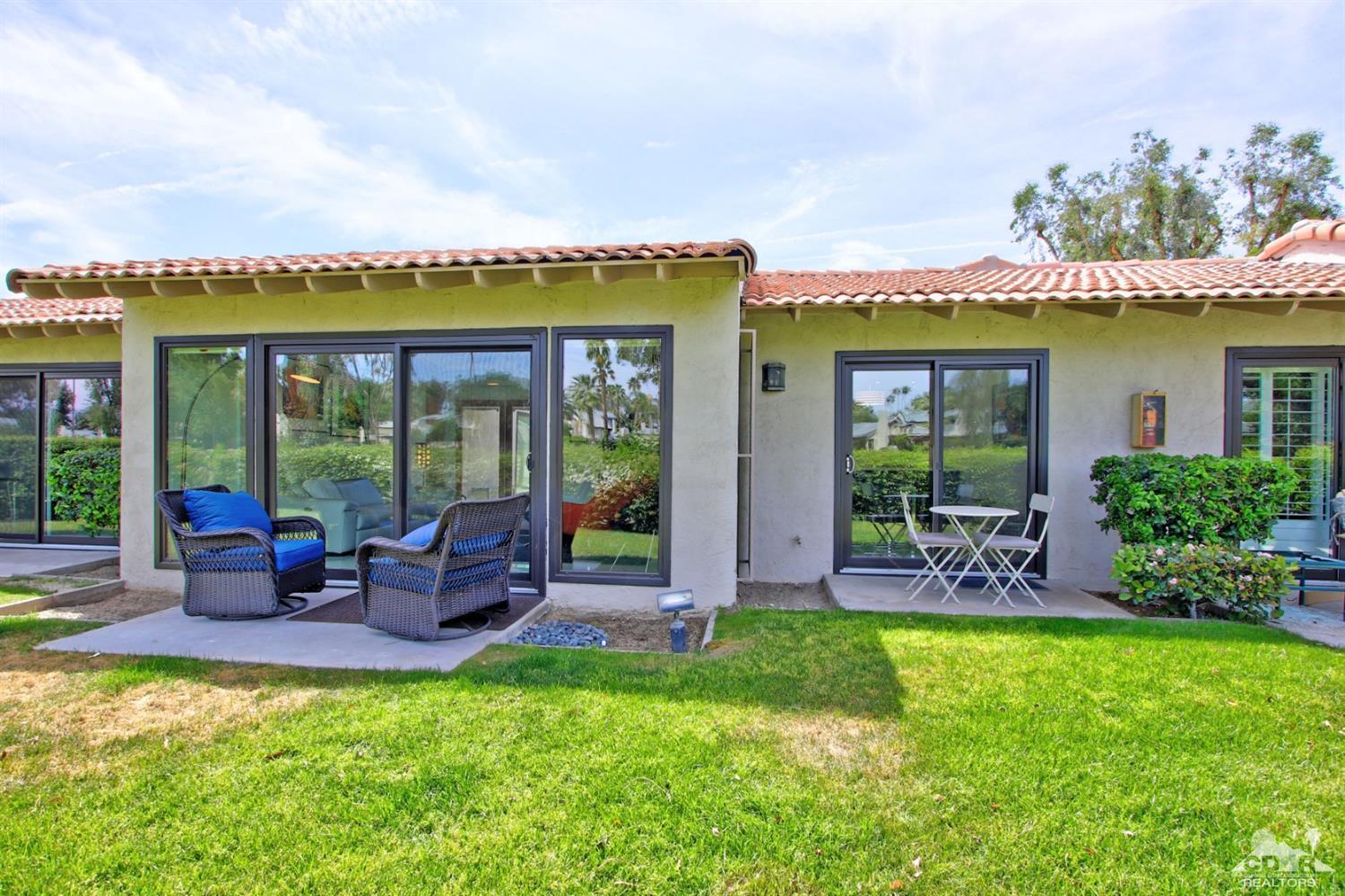 6012 East Driver Road Palm Springs, CA 92264 - Photo 35 of 47 a view of an house with backyard porch and furniture