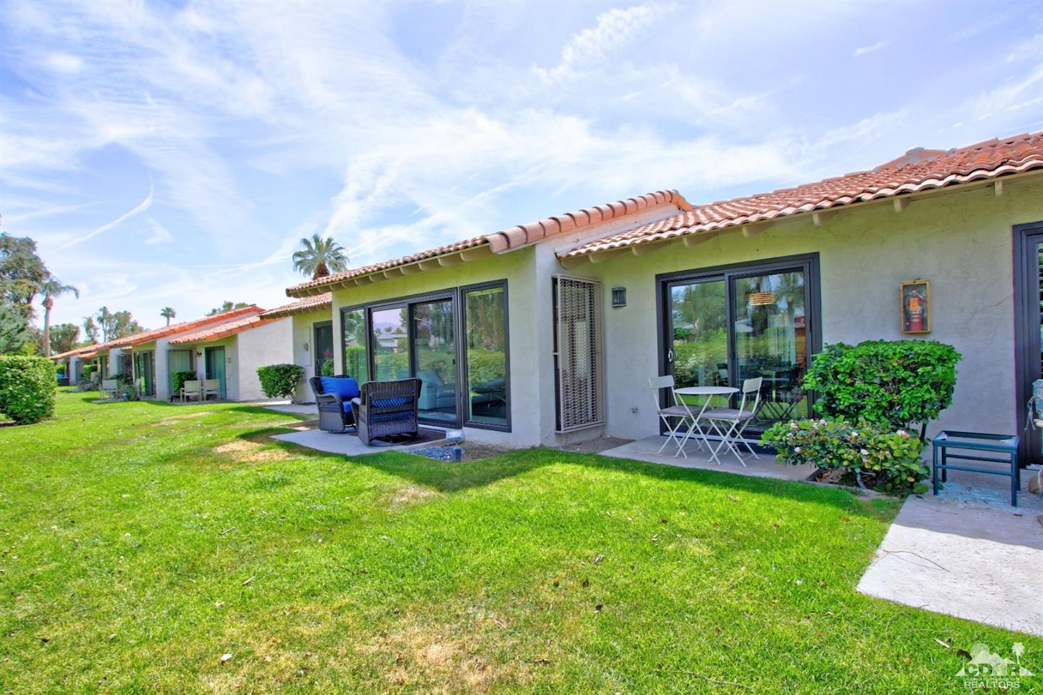 6012 East Driver Road Palm Springs, CA 92264 - Photo 37 of 47 a view of a house with a yard porch and sitting area