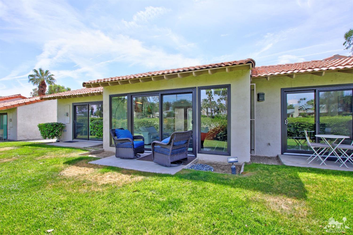 6012 East Driver Road Palm Springs, CA 92264 - Photo 39 of 47 a front view of house with yard and outdoor seating