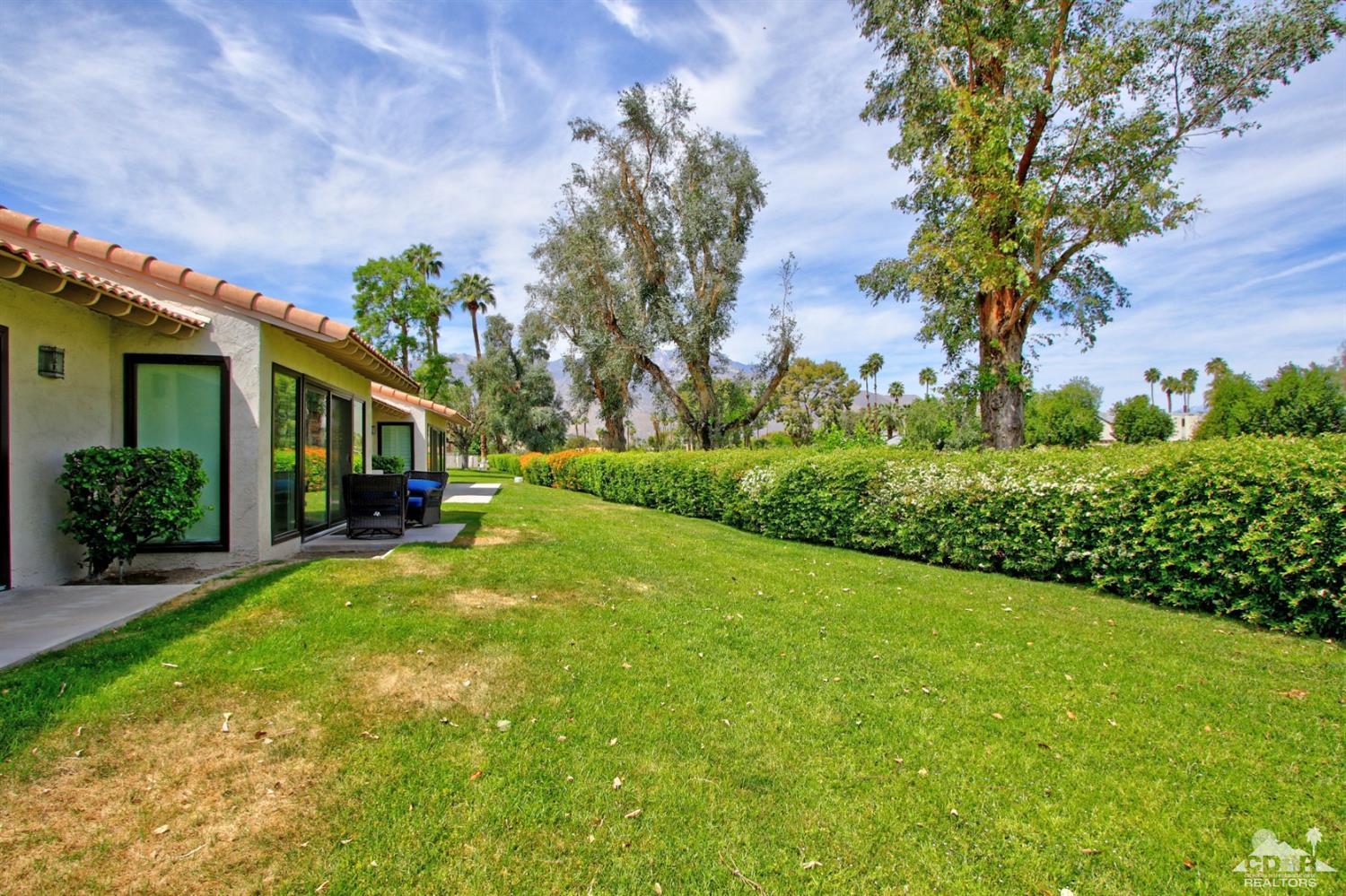 6012 East Driver Road Palm Springs, CA 92264 - Photo 40 of 47 a front view of a house with garden
