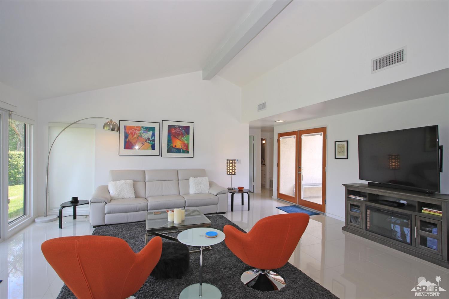 6012 East Driver Road Palm Springs, CA 92264 - Photo 8 of 47 a living room with furniture and a flat screen tv