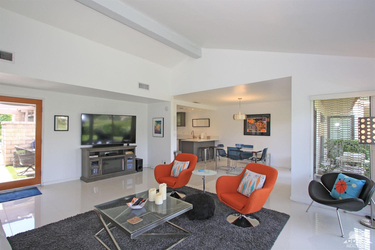 6012 East Driver Road Palm Springs, CA 92264 - Photo 10 of 47 a living room with furniture and a flat screen tv