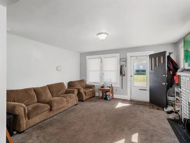 a living room with furniture and a couch