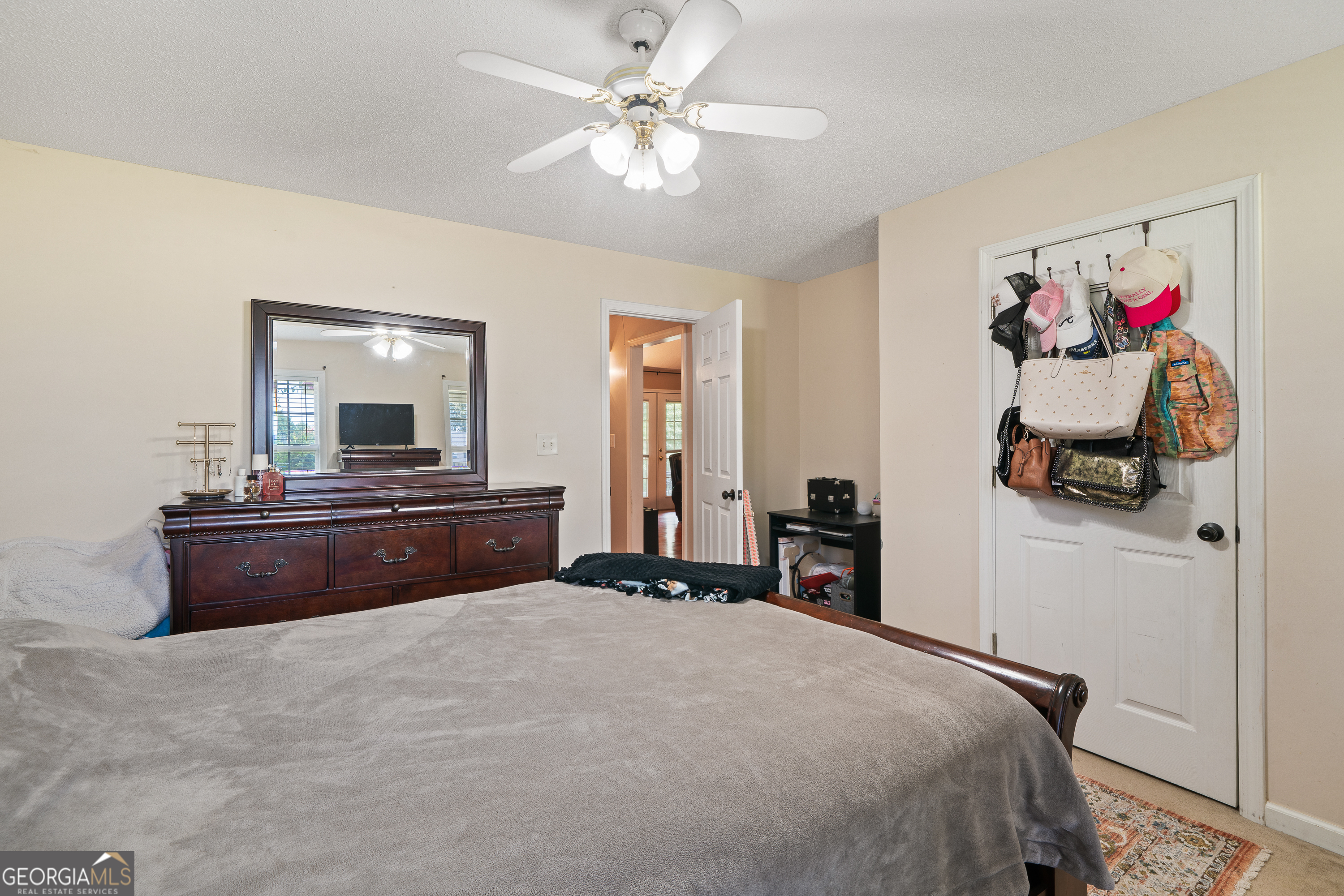 193 Virginia Avenue Gray, GA 31032 - Photo 16 of 48 a bedroom with a bed and a chandelier