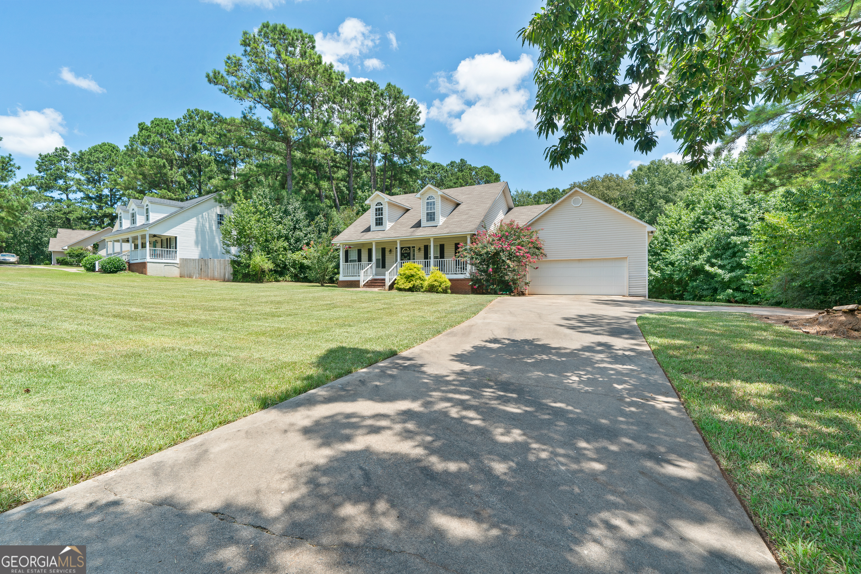 193 Virginia Avenue Gray, GA 31032 - Photo 2 of 48 a front view of a house with a yard and trees