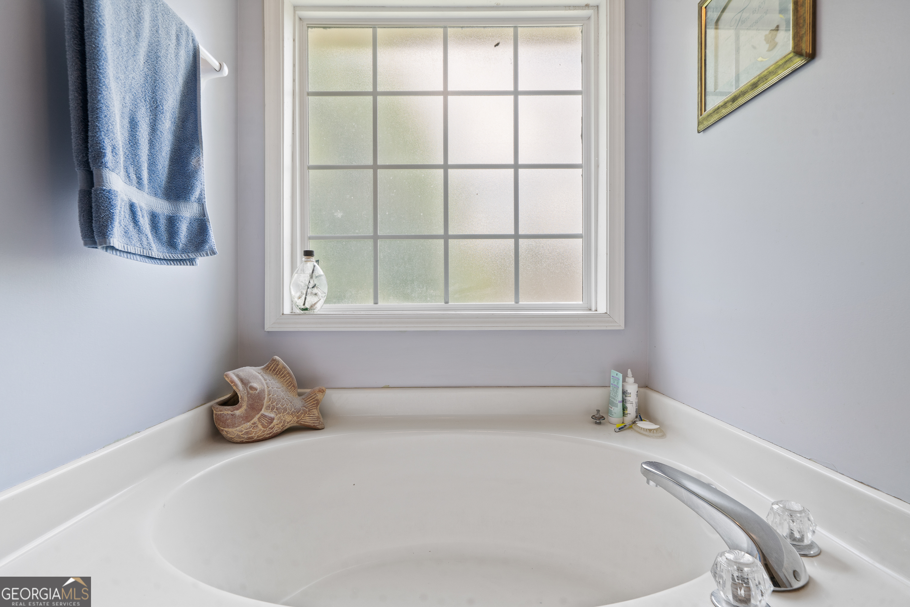 193 Virginia Avenue Gray, GA 31032 - Photo 33 of 48 a white bath tub sitting next to a window