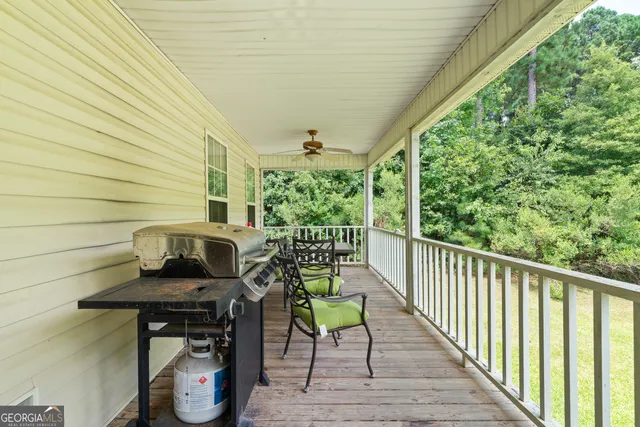 a view of a chairs and table on the balcony