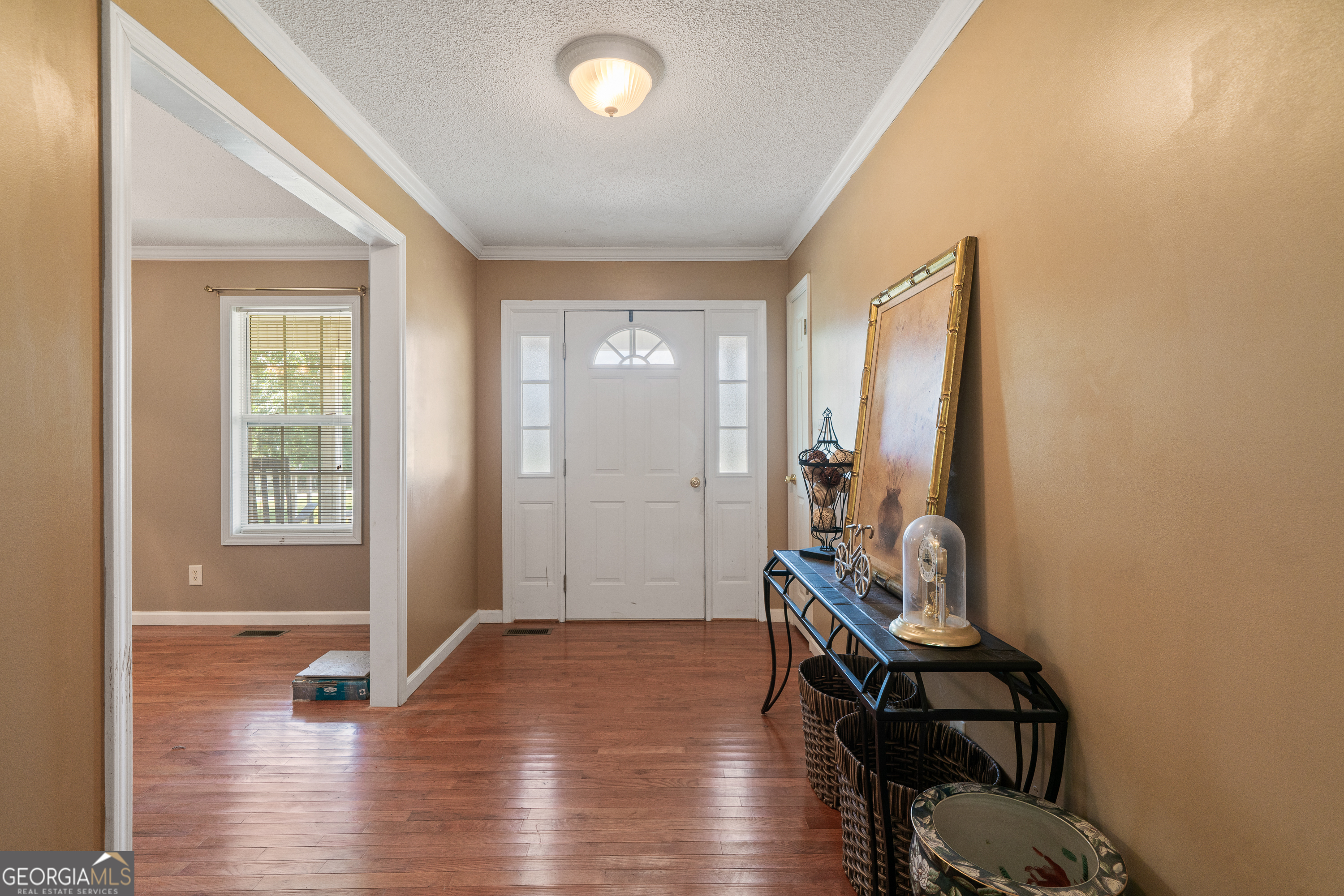 193 Virginia Avenue Gray, GA 31032 - Photo 8 of 48 a view of an entryway with wooden floor