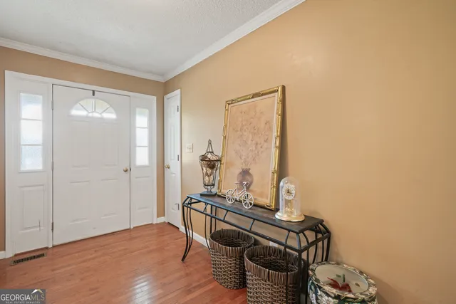 a room with furniture and wooden floor