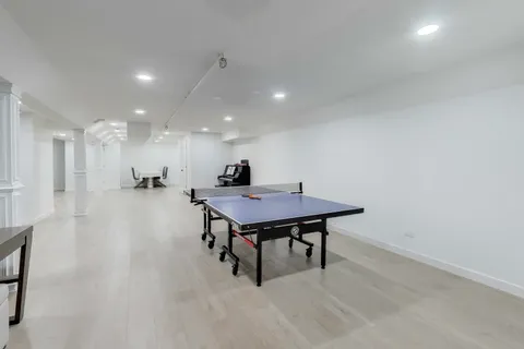 a bedroom with a bed and a night stand