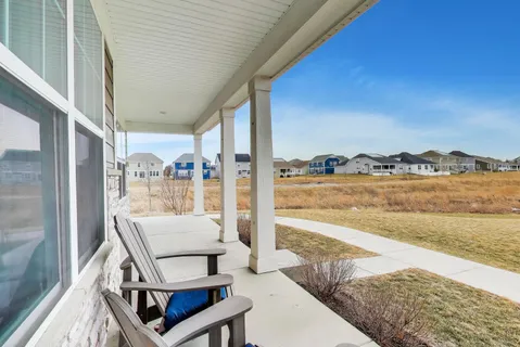 a balcony with furniture and city view