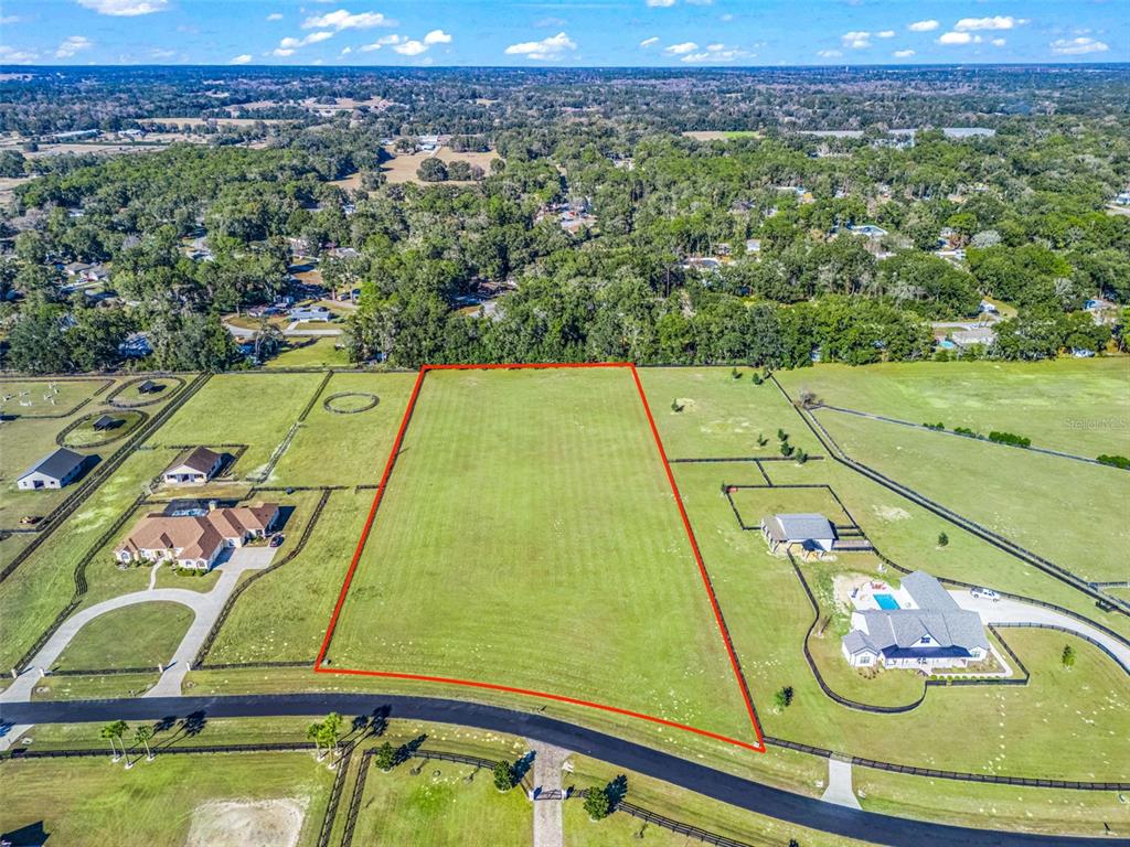 a view of a yard with an outdoor seating