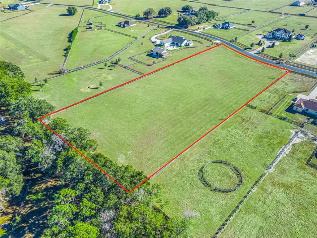 54 Northwest 54th Loop Ocala, FL 34482 - Photo 6 of 13 a view of a balcony with a table and chairs