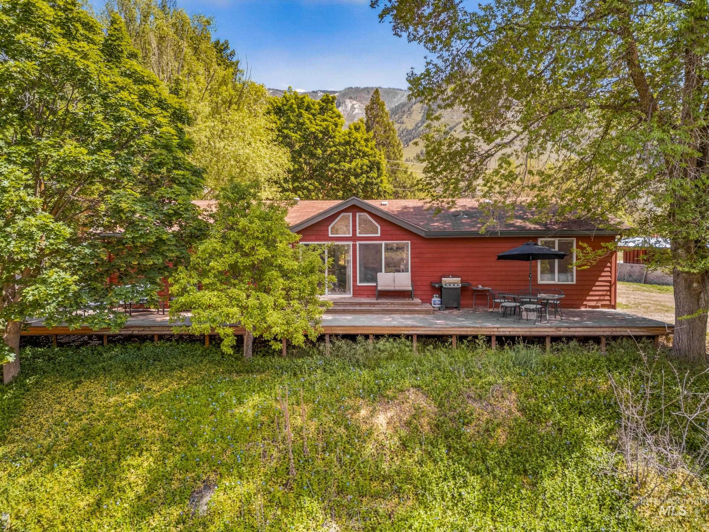 151 Cow Creek Road Lucile, ID 83542 - Photo 3 of 50 Red-sided residence featuring a spacious wood-finish deck