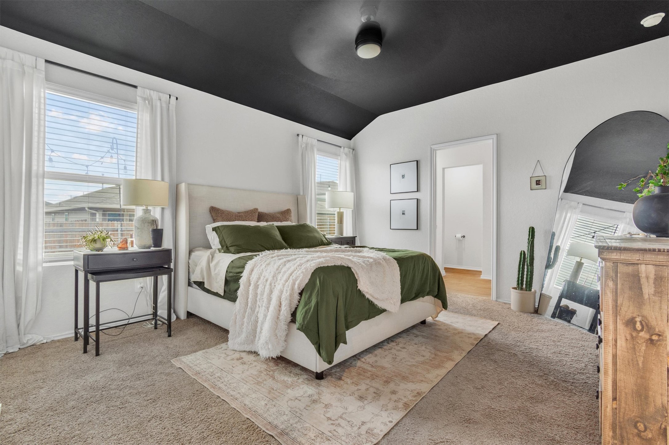 204 Calgary Lane San Marcos, TX 78666 - Photo 11 of 23 Tasteful accent ceiling in the primary suite adds some great detail to the home.