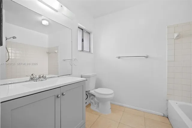 a bathroom with a sink toilet and vanity