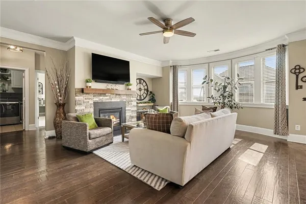 a en suite bathroom with a granite countertop sink and a mirror