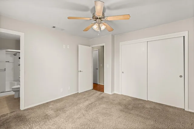 a view of a chandelier fan in a room