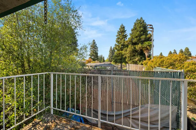 a view of a balcony with a swing