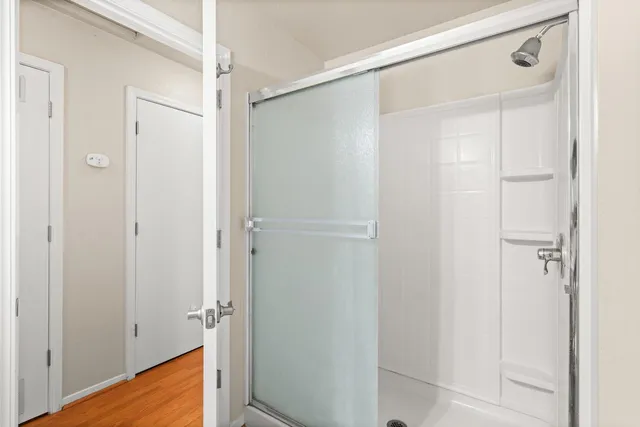 a view of room with hardwood floor and closet