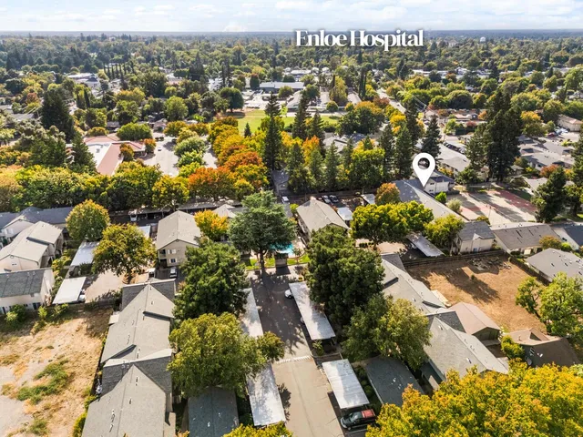 an aerial view of residential houses with outdoor space