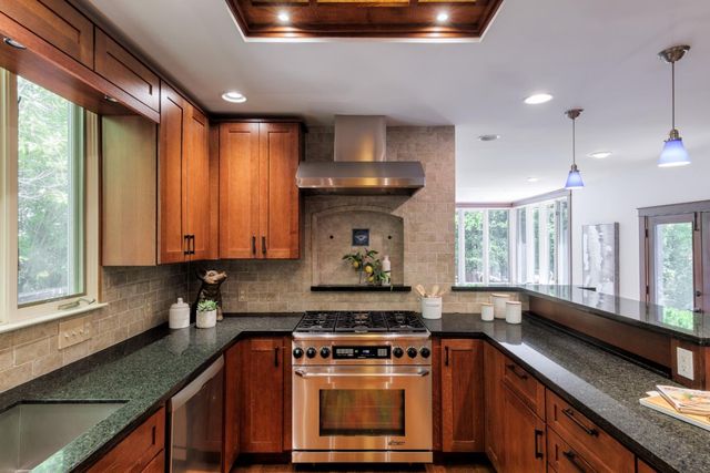 a kitchen with a stove and a sink
