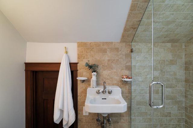 a bathroom with a sink vanity and toilet