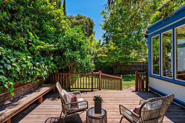 a view of a chair and tables in the balcony