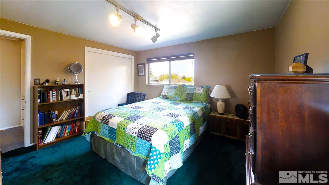 3333 Menlo Court Reno, NV 89509 - Photo 15 of 29 a bed sitting in a bedroom next to a window