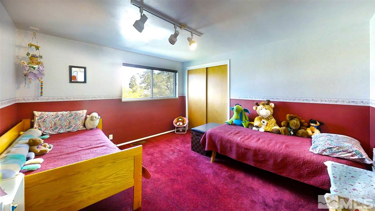 3333 Menlo Court Reno, NV 89509 - Photo 18 of 29 a bed room with a bed and a couch