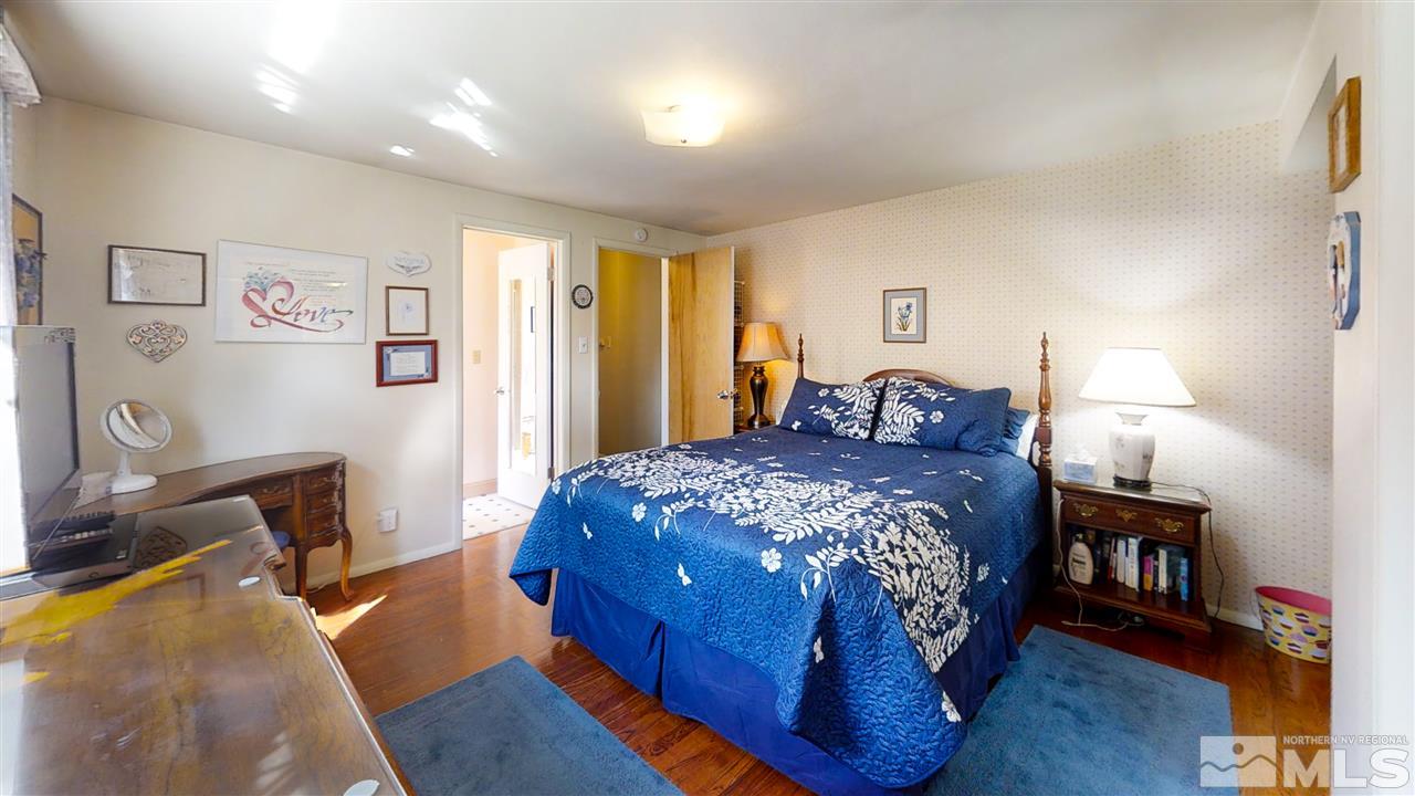 3333 Menlo Court Reno, NV 89509 - Photo 22 of 29 a bedroom with a bed and wooden floor