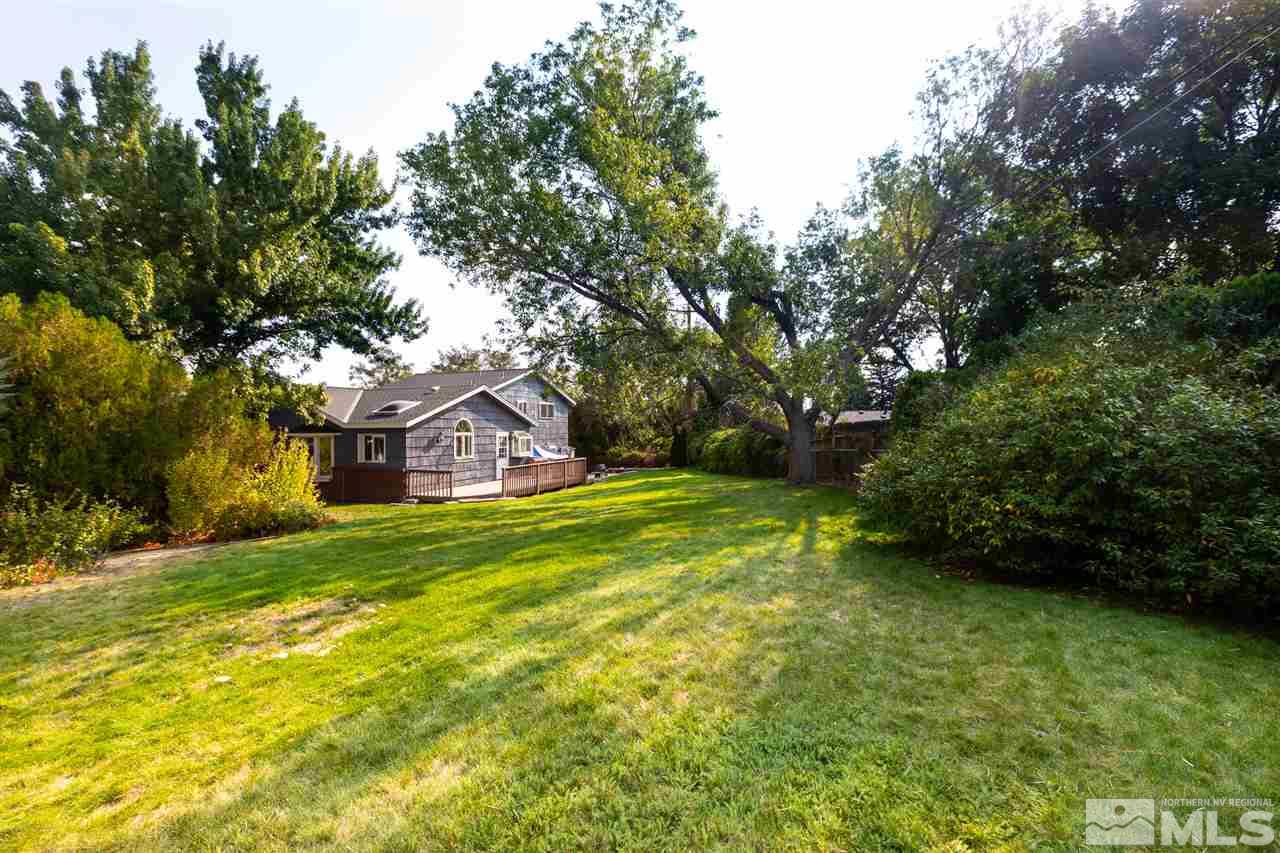 3333 Menlo Court Reno, NV 89509 - Photo 24 of 29 a yellow house in middle of the green field