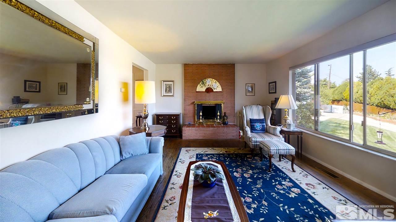 3333 Menlo Court Reno, NV 89509 - Photo 4 of 29 a living room with furniture fireplace and a large window