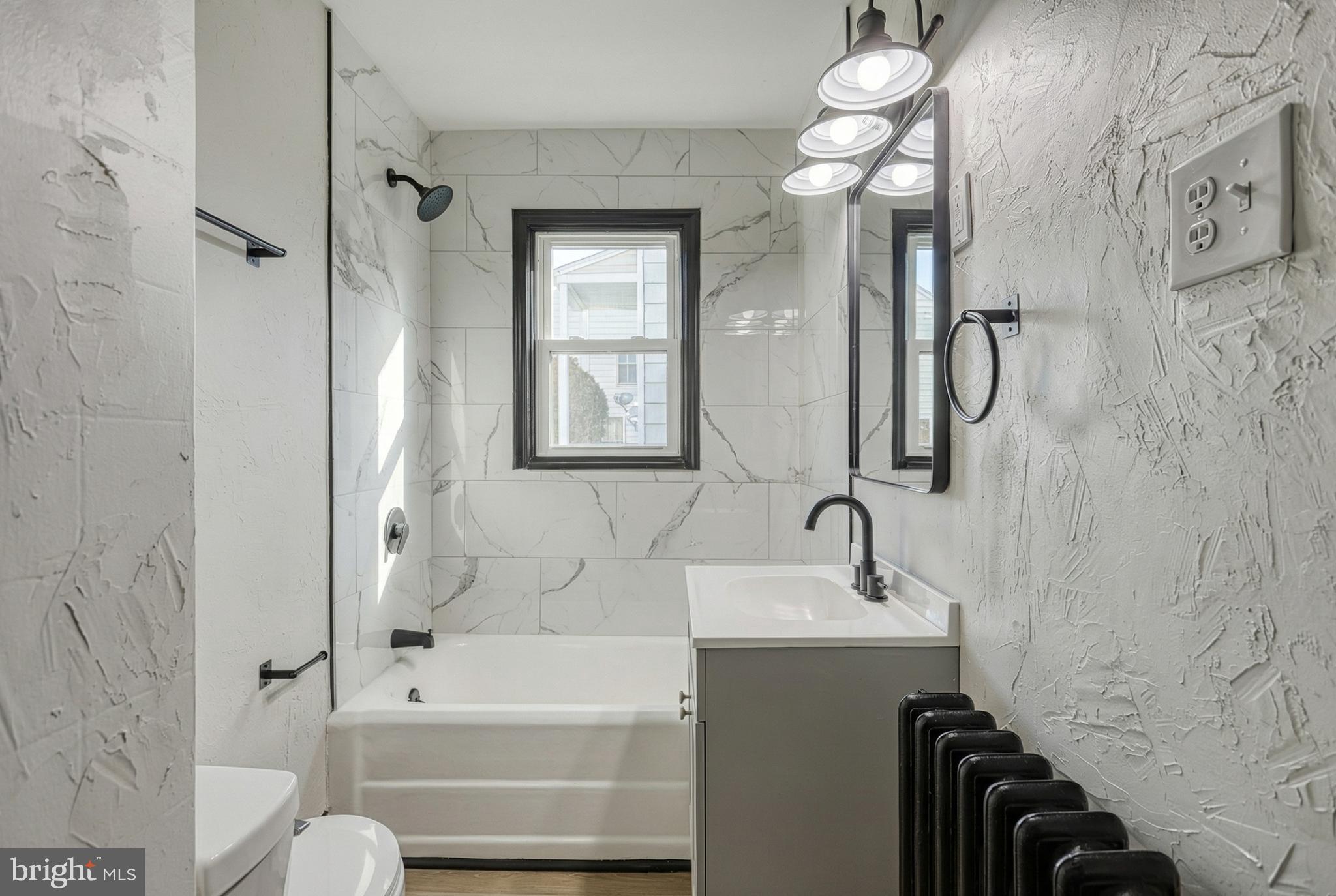 327 Norway Street York, PA 17403 - Photo 15 of 64 a bathroom with a sink a toilet and shower
