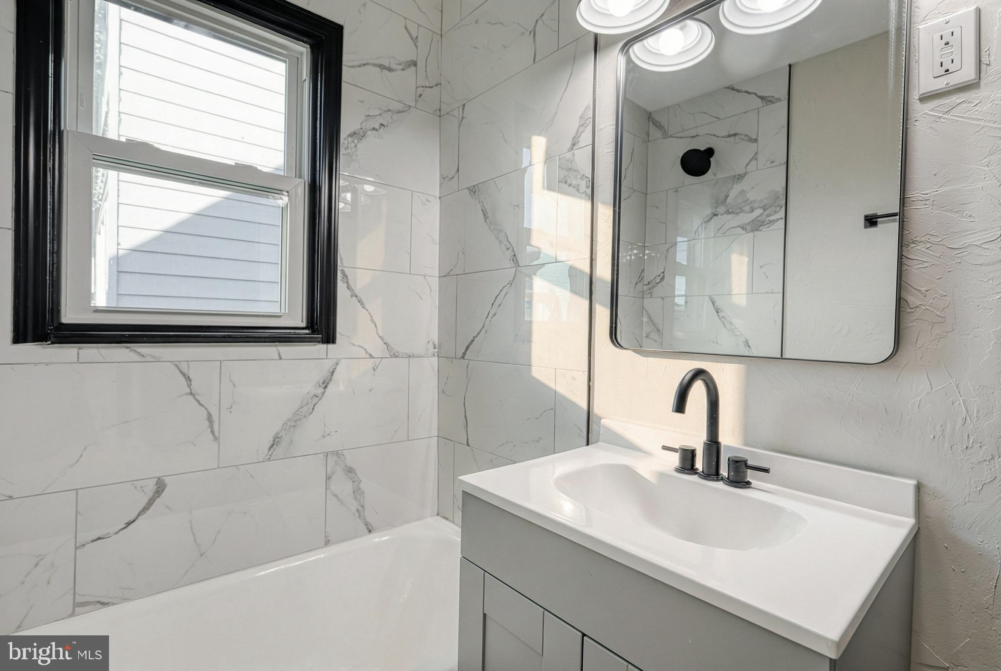 327 Norway Street York, PA 17403 - Photo 16 of 64 a bathroom with a sink and a mirror