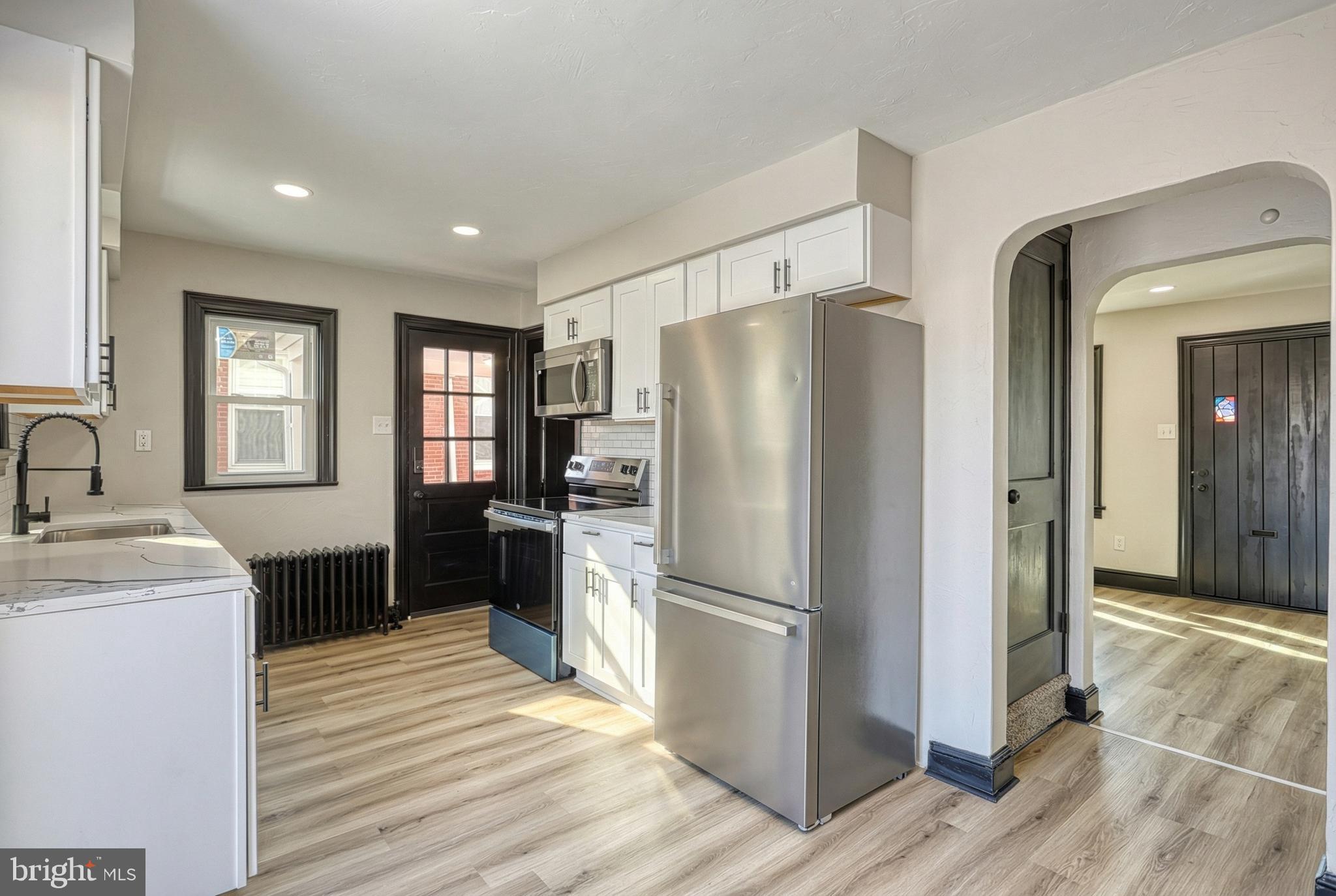 327 Norway Street York, PA 17403 - Photo 17 of 64 a kitchen with a refrigerator cabinets and wooden floor