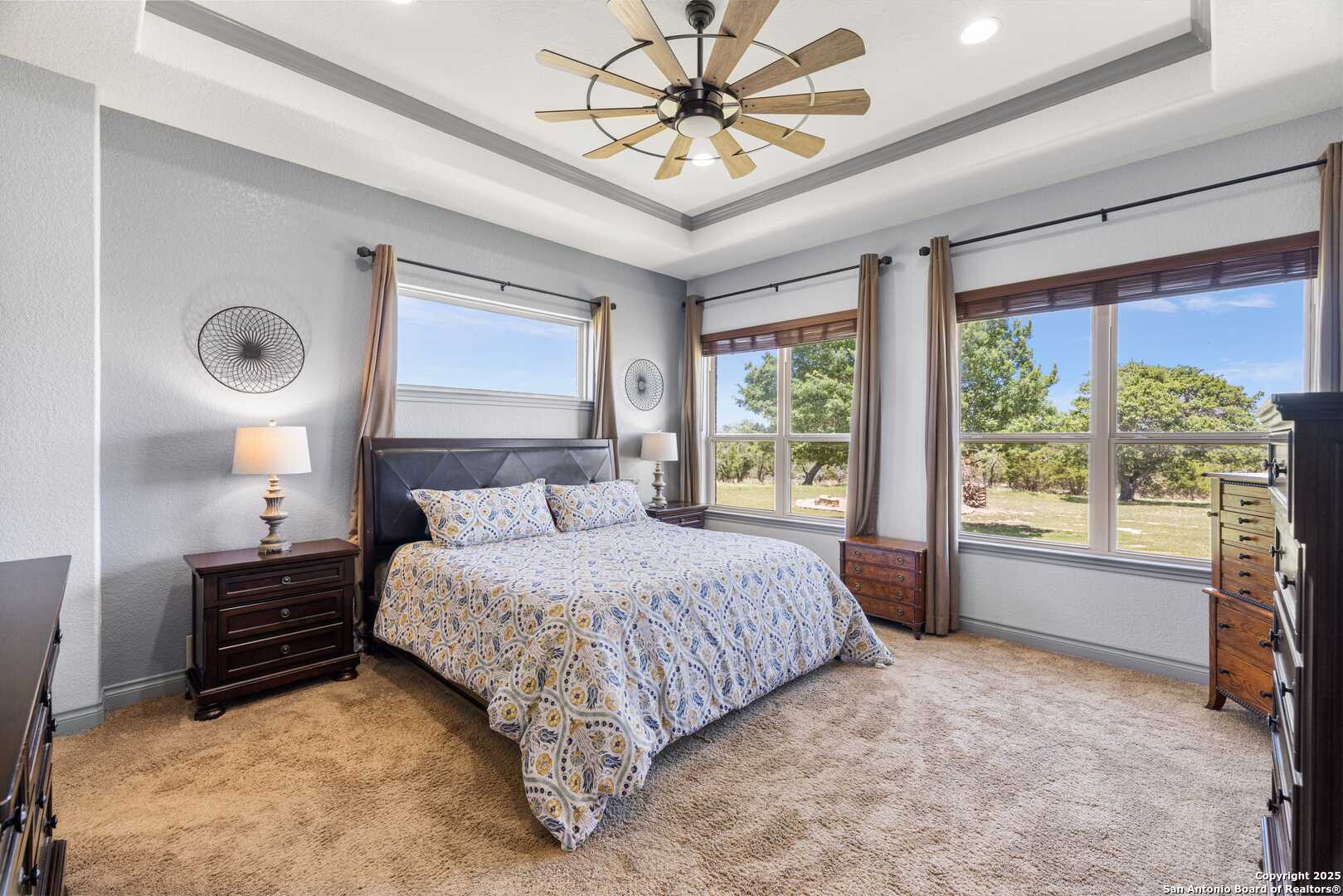 997 Kramer Road Harper, TX 78631 - Photo 19 of 45 a bedroom with a bed and a large window