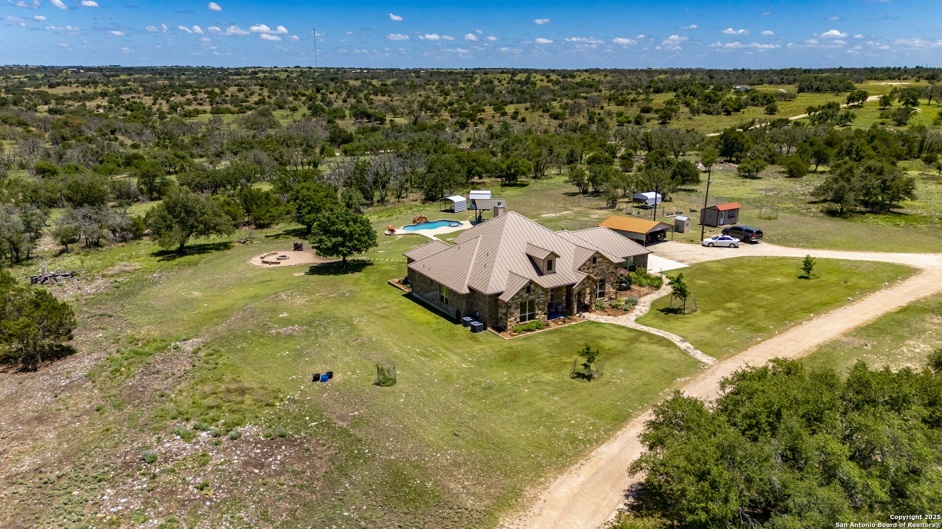 997 Kramer Road Harper, TX 78631 - Photo 2 of 45 a view of a swimming pool and outdoor space